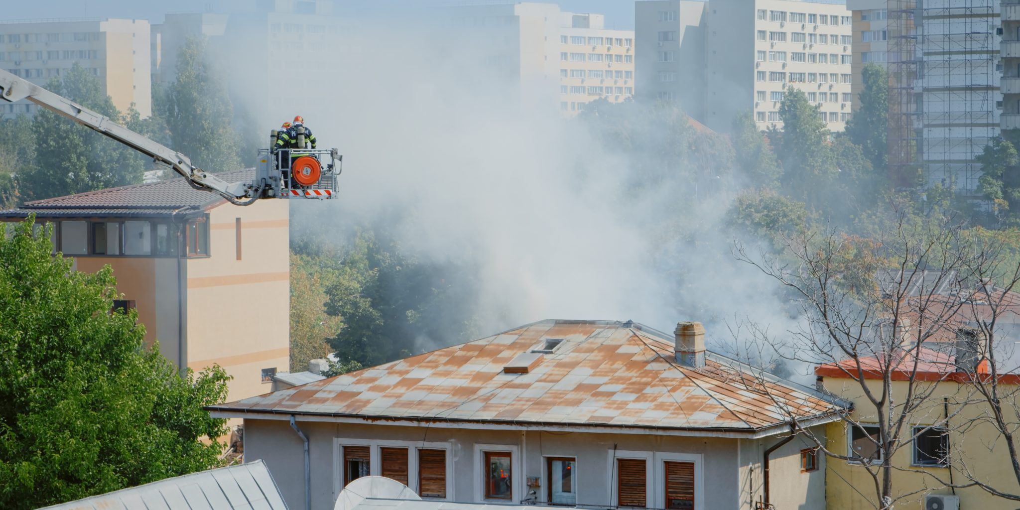 close-up-of-firefighters-on-platform-truck-helping-2021-12-09-17-04-24-utc fire
