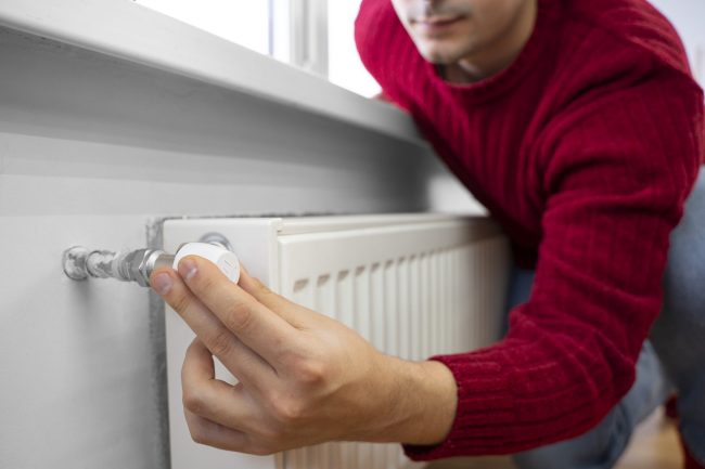 close-up-man-using-rotary-switch maintenance