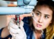 woman-fixing-kitchen-sink